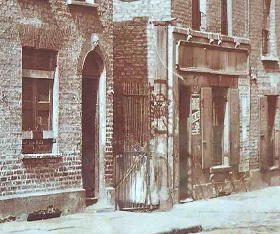 Entrance to Dutfield's Yard, Berner Street: a tinted detail of a photograph of 7 April 1909, twenty years after the murder.. Photograph of 1909: the yard entrance as it was then, not in 1888